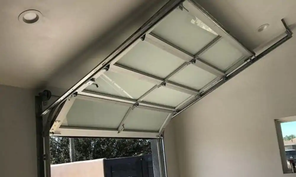 réparation porte sectionnelle Louvres
