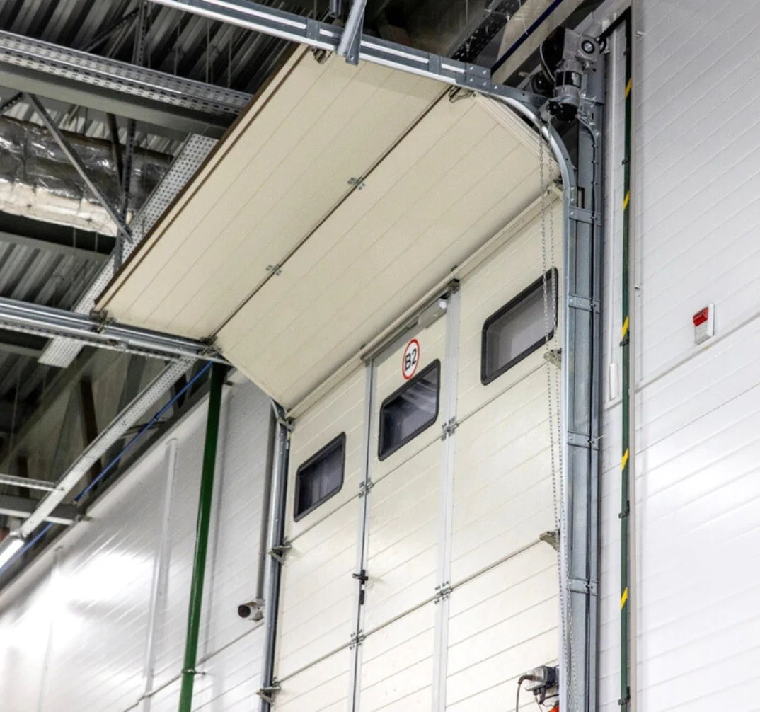Réparation porte garage sectionnelle industrielle Villenoy